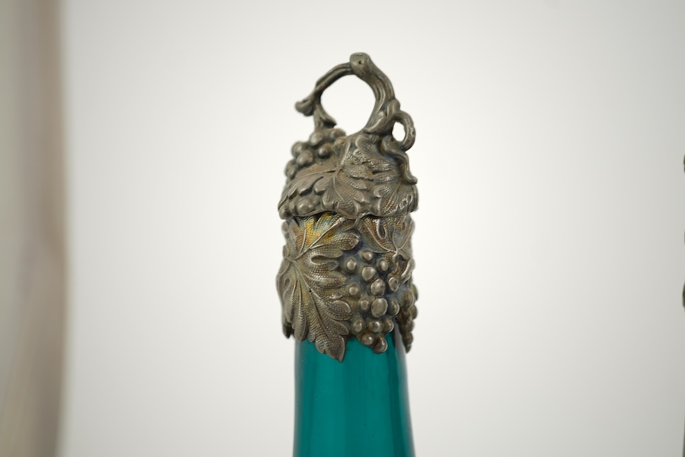 A composed set of six mid 19th century vari-coloured glass carafes